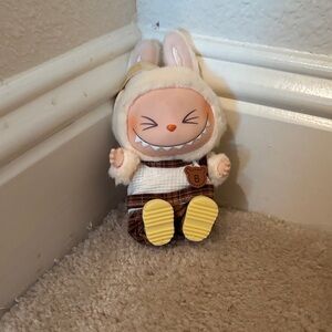 Sisi labubu with clothes have a seat